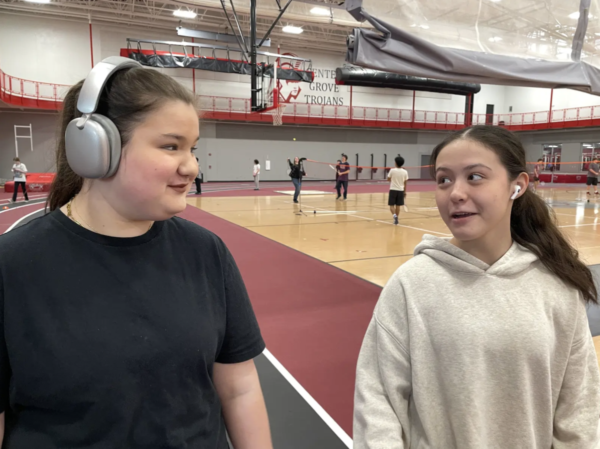 Sophomores Nora Fletcher and Lydia Towne walk around the track of the SAC during 1st period gym class. “I love walking during gym class because it helps me get my steps in,” Fletcher said. “It gets me going in the morning for a day at school and I get to talk to my friends.”