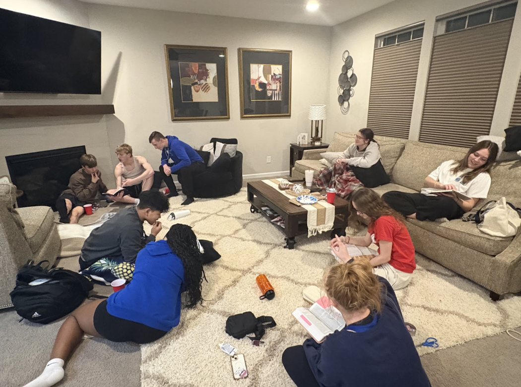 Member of the CG Sound System Bible Study gather together in Senior Callie Painter's home after rehearsal.