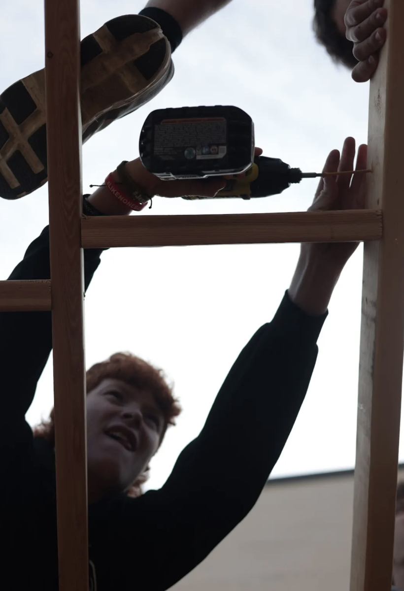 In Mr. Werner's seventh period construction class Devan Royalty drills a screw into two pieces of wood on a shed. The class is preparing to go a shed building competition next week at the Carpenters Apprenticeship school in Southport. "My favorite thing about this project is getting to work with my peers and being able to make new friends," Royalty said.