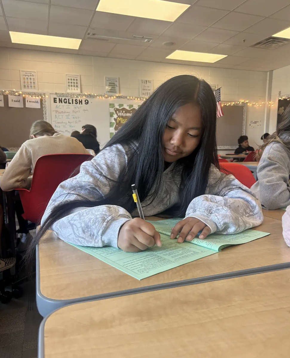 Analyzing lines from Romeo and Juliet, freshman Ruby Ling works to translate the meaning behind each scene. Students in Ms. Culver’s English 9 honors class are reading the stage play of Romeo and Juliette together as different parts in order to better understand each character.  “I like reading this as a class because having everyone read as a different character helps me visualize the characters better and enjoy the love story more.”