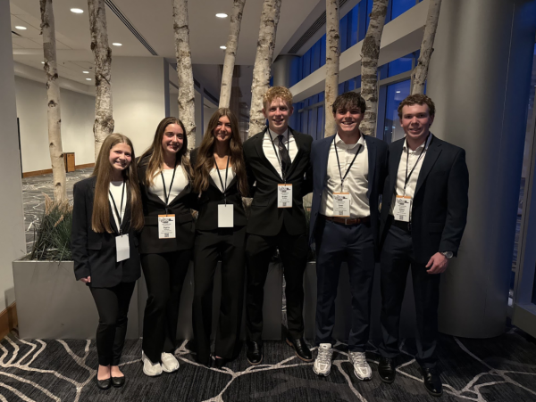 Seniors Nova Hunter, Sophia LaRocca, Avery Osborne, Braden Komlanc, Owen Sowers, and Will McCrea pose for a group photo before presenting their HOSA presentation.