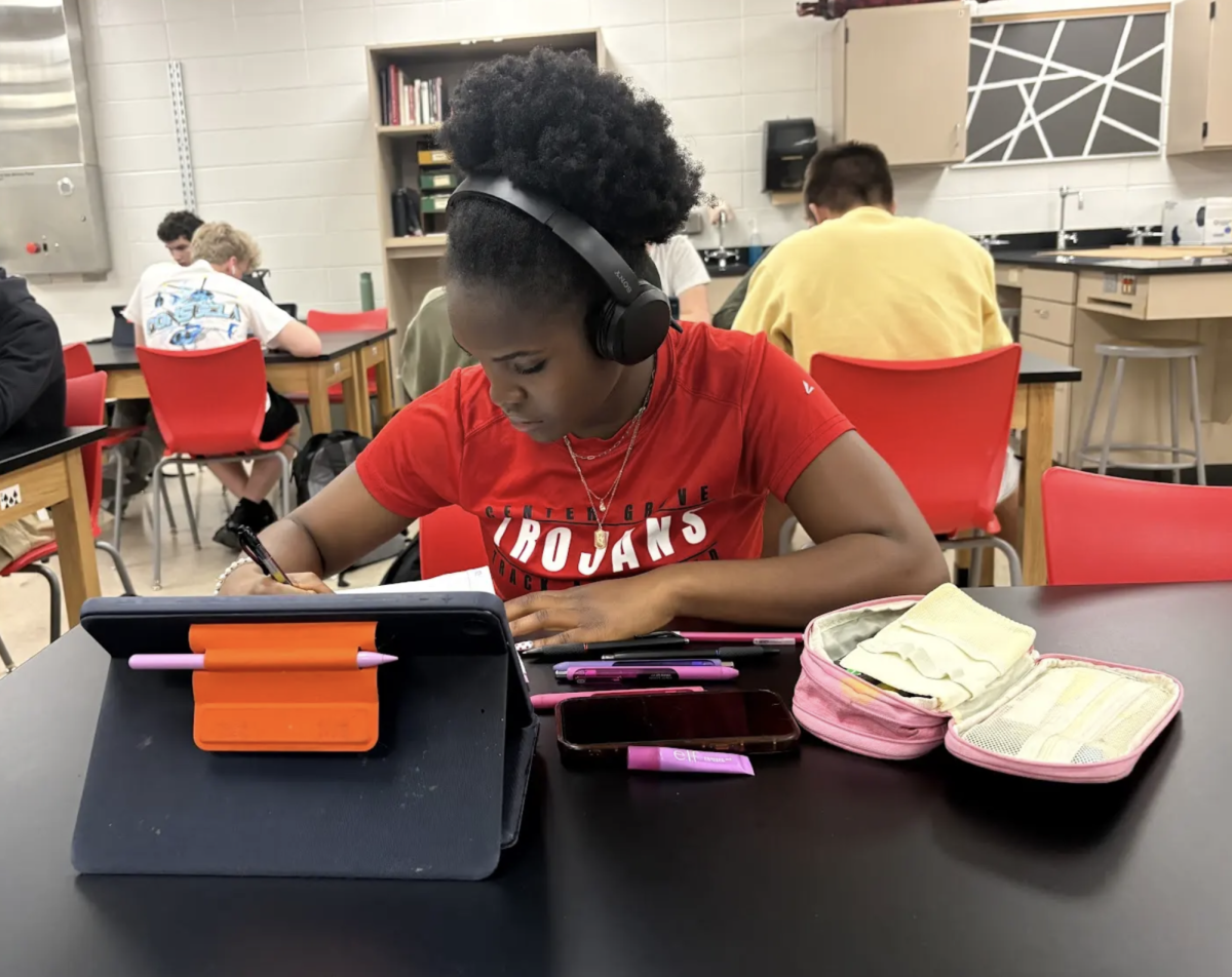 Taking notes, Senior Marilyn Jallah sits in Physics class. During this unit, Jallah learned about different waves and frequencies. “I like physics because it lets me see the world differently,” Jallah said. “It helps me understand how the things around me act."