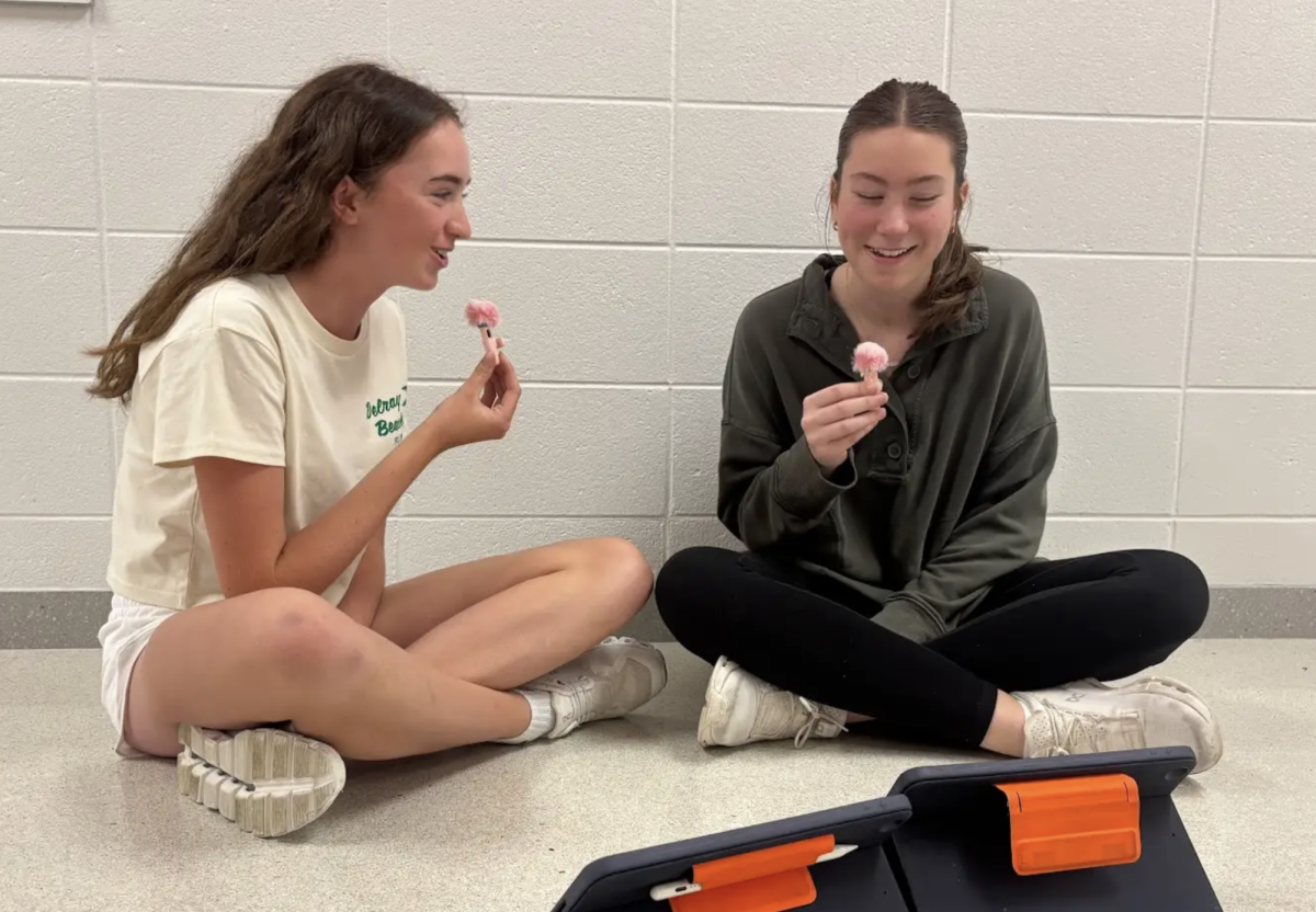 While recording a documentary, Freshmen Addie Walterman and Ruthie Hickman discuss tribalism for their project in English 9 Honors. Students could pick a variety of projects to do over their "Romeo and Juliet" topic such as an argument essay, podcast, documentary, or a map. “We’re talking about tribalism because it’s how people often form groups based on people that are like them,” Hickman said. “Since there is a family feud in 'Romeo and Juliet' and they form groups, we wanted to relate it to real life.”