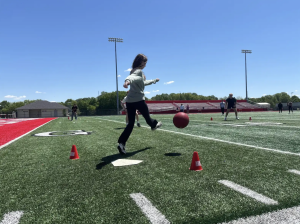 While participating in APUSH kickball, Junior Nora Liden strikes the ball with her foot. Every year following AP testing, Joshua Hart’s APUSH classes take a trip outdoors to have a friendly competition of kickball on the football field. “I had a lot of fun because I haven’t played kickball since middle school,” Liden said. “We got to be outside and it was nice out. I don’t remember the score but I know my team sadly lost.”